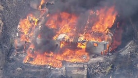 Massive fire burning down homes