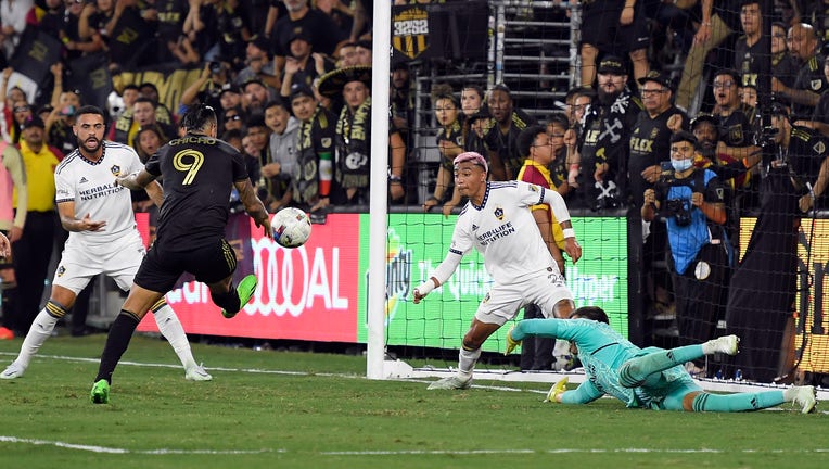 Cristian Arango #9 of LAFC scores the winning goal against goalkeeper Jonathan Bond #1 and defender Julian Araujo #2 of LA Galaxy. (Photo by Kevork Djansezian/Getty Images)