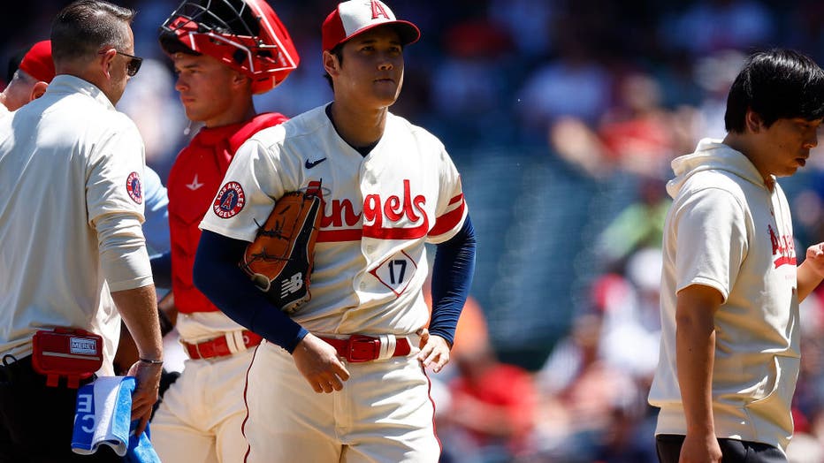 Shohei Ohtani #17 of the Los Angeles Angels leaves the game against the Cincinnati Reds. (Photo by Ronald Martinez/Getty Images)