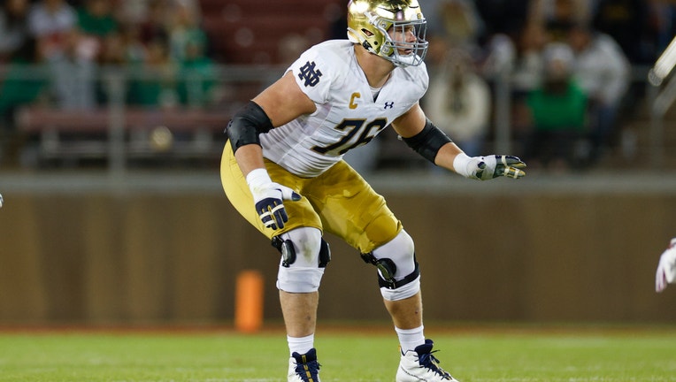 Joe Alt #76 of the Notre Dame Fighting Irish blocks in the second half during a game against the Stanford Cardinal at Stanford Stadium on November 25, 2023 in Stanford, California. (Photo by Brandon Sloter/Image Of Sport/Getty Images)