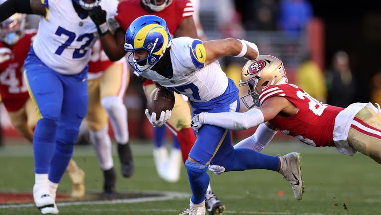 Puka Nacua #17 of the Los Angeles Rams catches a pass breaking the "total receiving yards in a season for a rookie" record against Isaiah Oliver #26 of the San Francisco 49ers at Levi's Stadium on January 07, 2024 in Santa Clara, California. (Photo by Ezra Shaw/Getty Images)